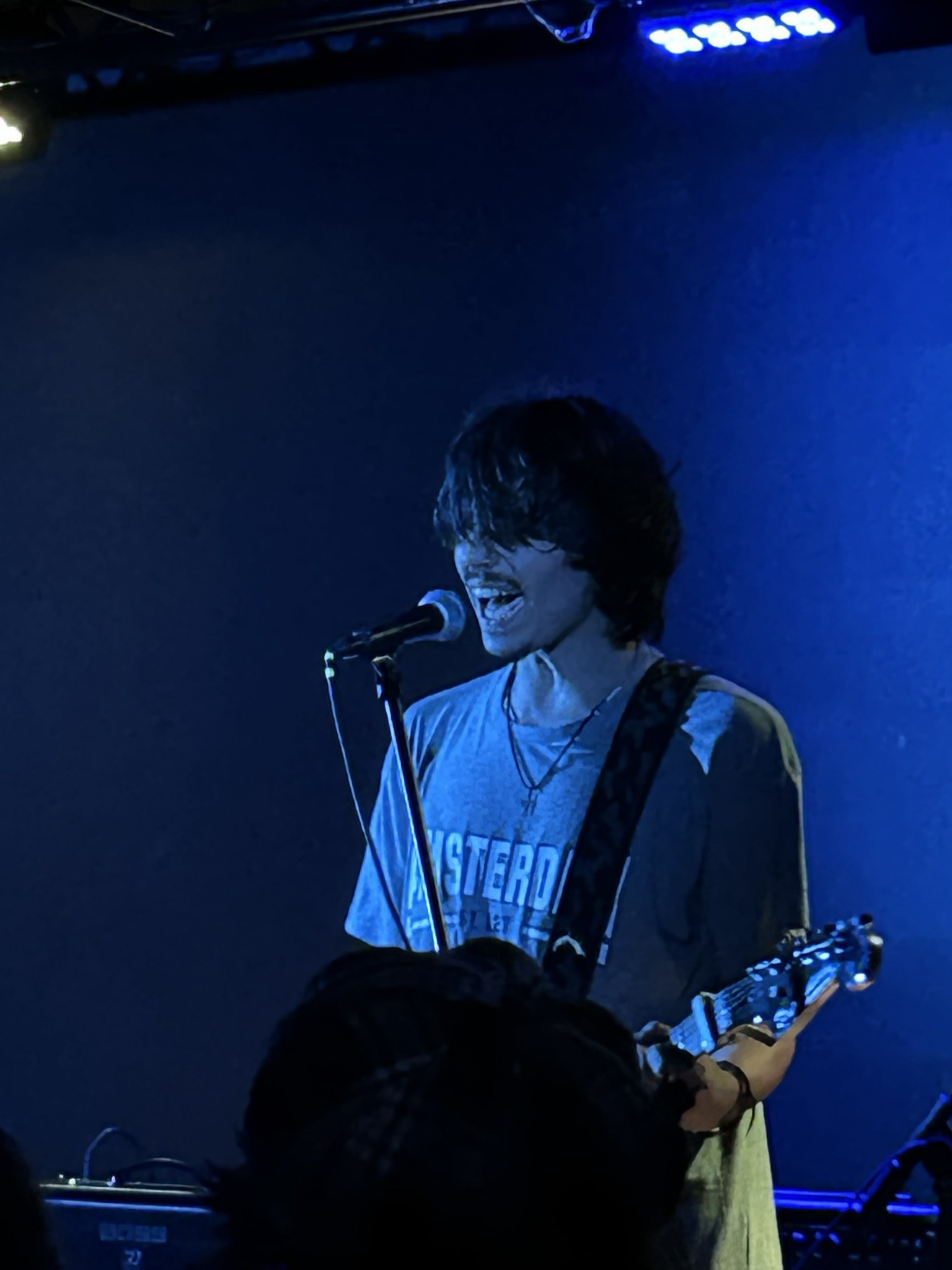 Caetano singing and playing guitar live