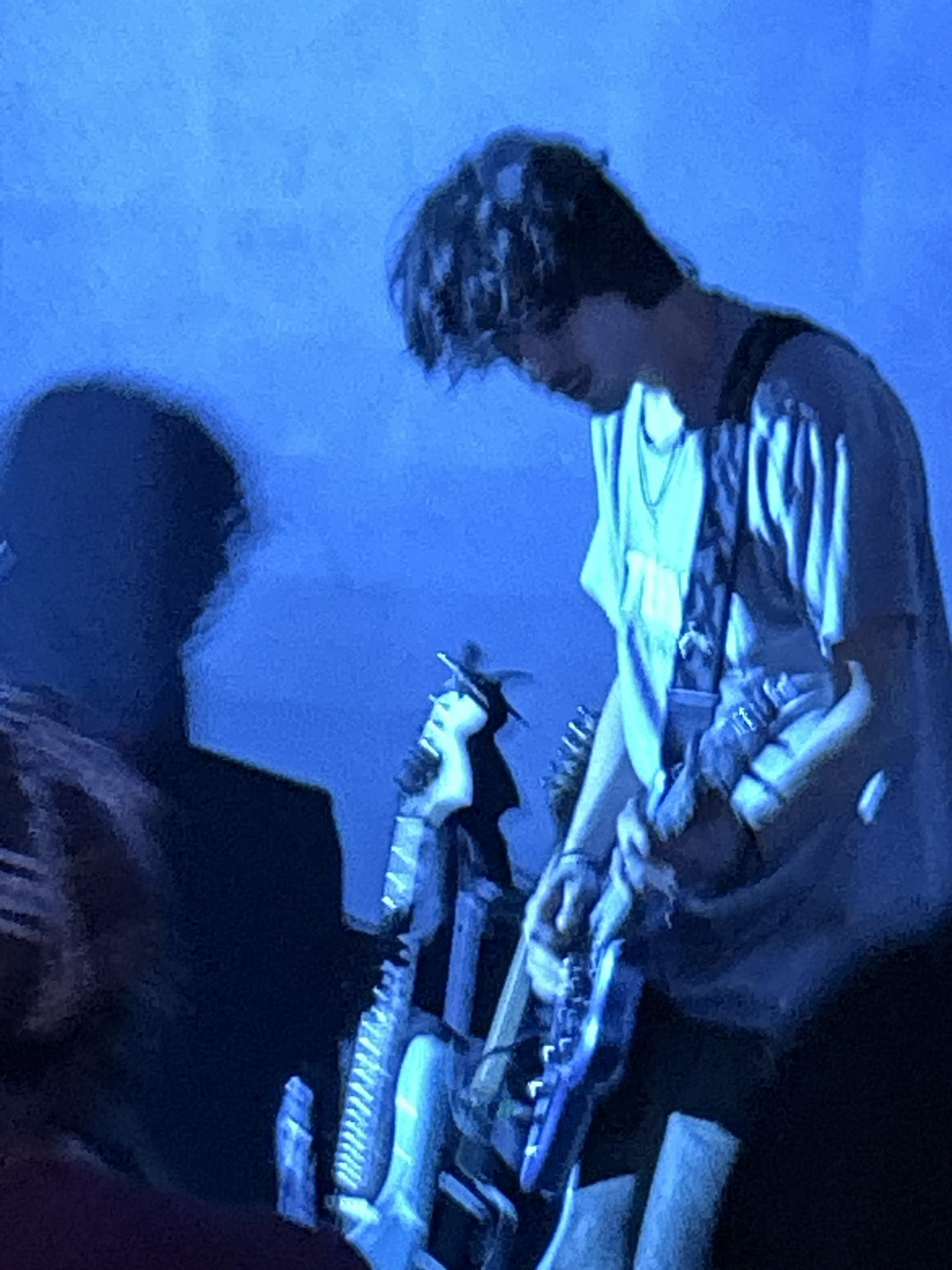 Caetano playing guitar live on stage